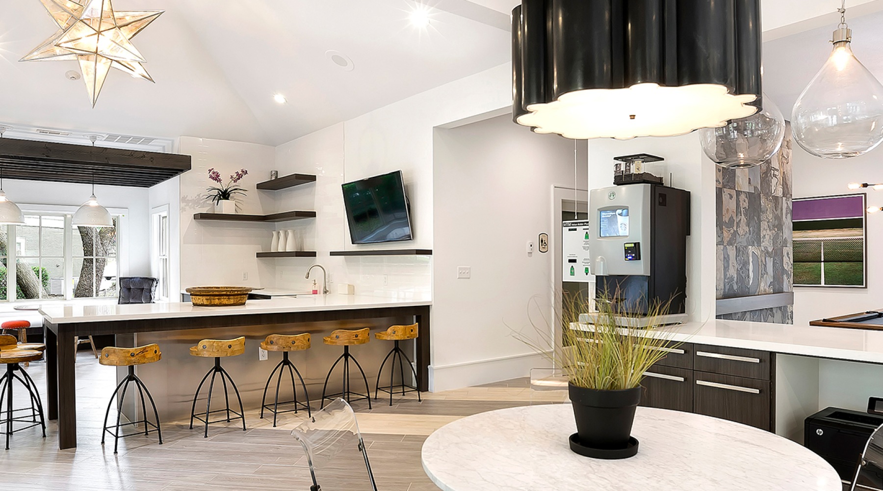 The essence of exceptional living clubroom with a coffee bar and long table with a tv