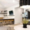 clubroom with a coffee bar and long table with a tv