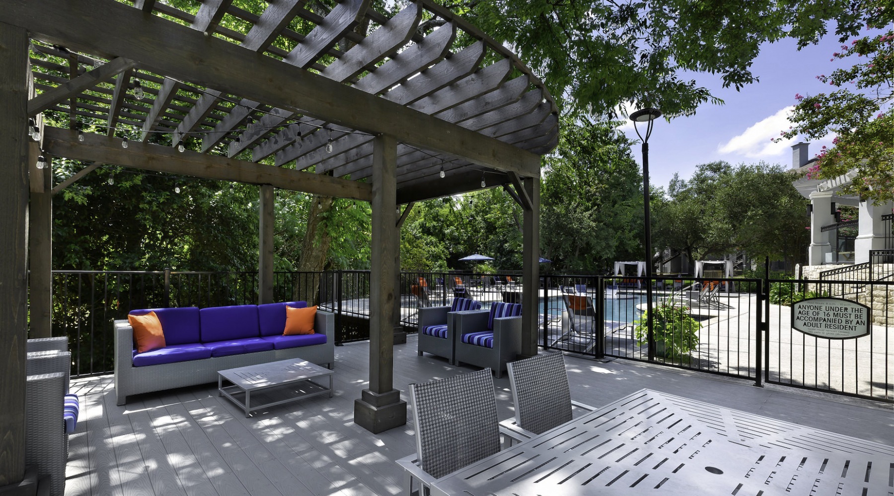 Love where you live Outdoor terrace next to pool at Folio North Austin apartments